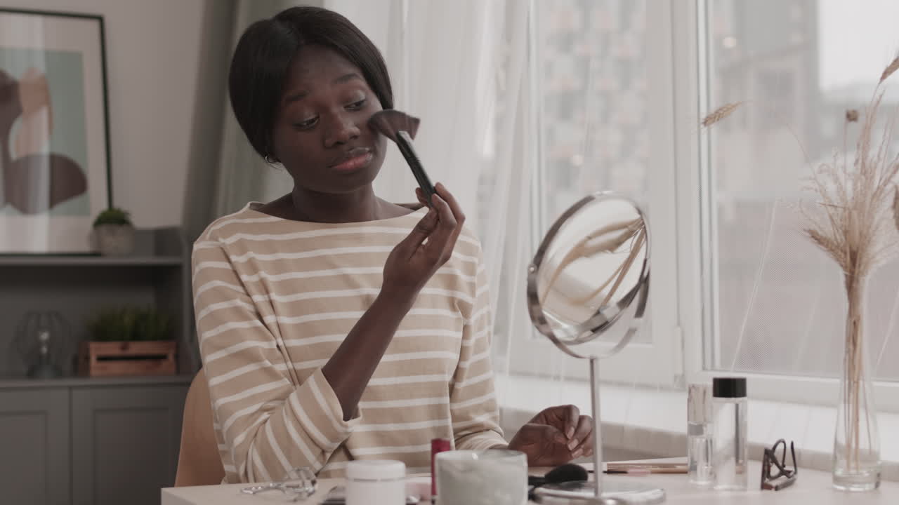 Young African Woman Doing Make up