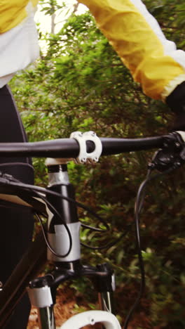 male mountain biker riding in the forest