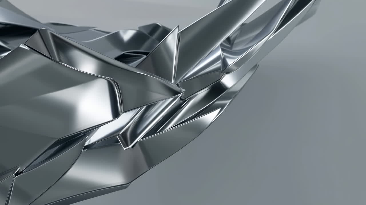 Forma geometrica metallica astratta in rotazione lenta