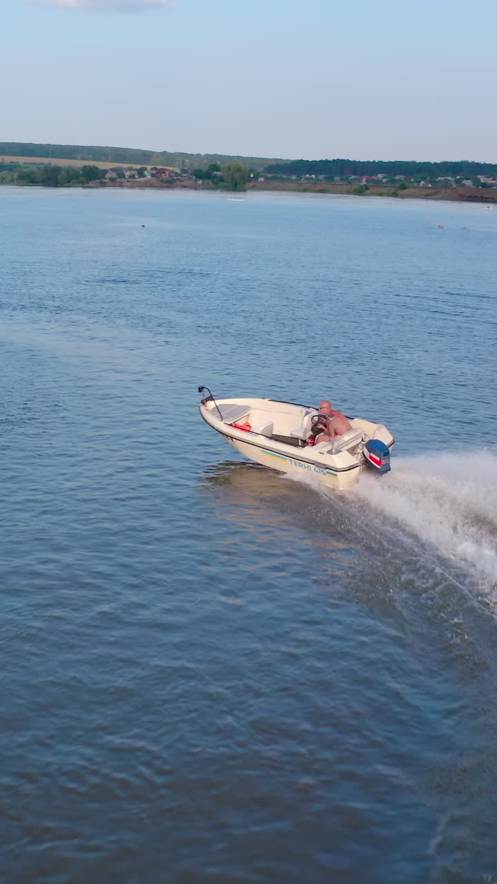 Motor boat sails on river