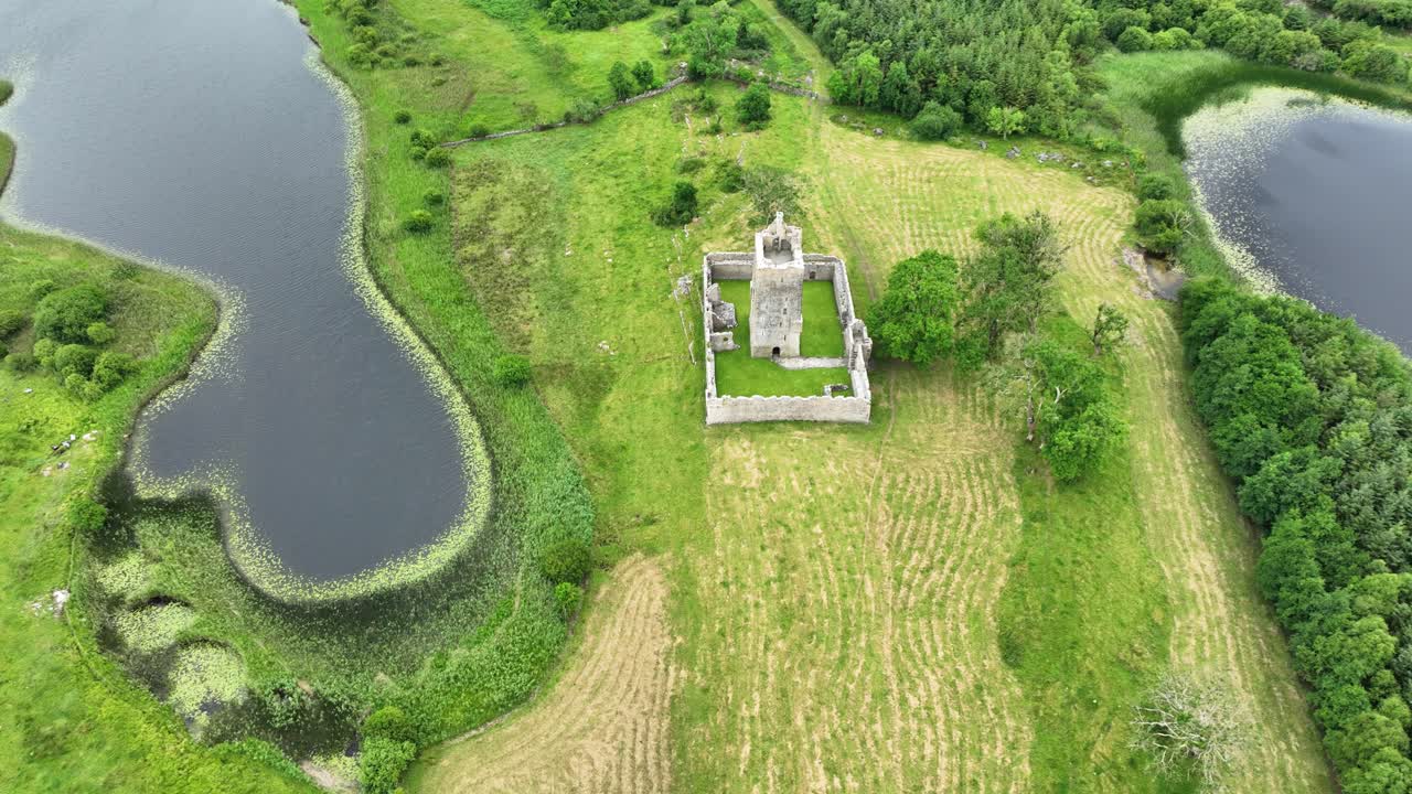 Ireland castles Fiddaun Castle the Burren Galway drone circling lakes and lush green landscape mid summer