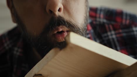 Handheld-video-of-carpenter-using-wood-heat-gun