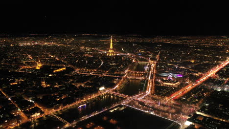 centre of paris by night aerial eiffel tower la seine river france city of light