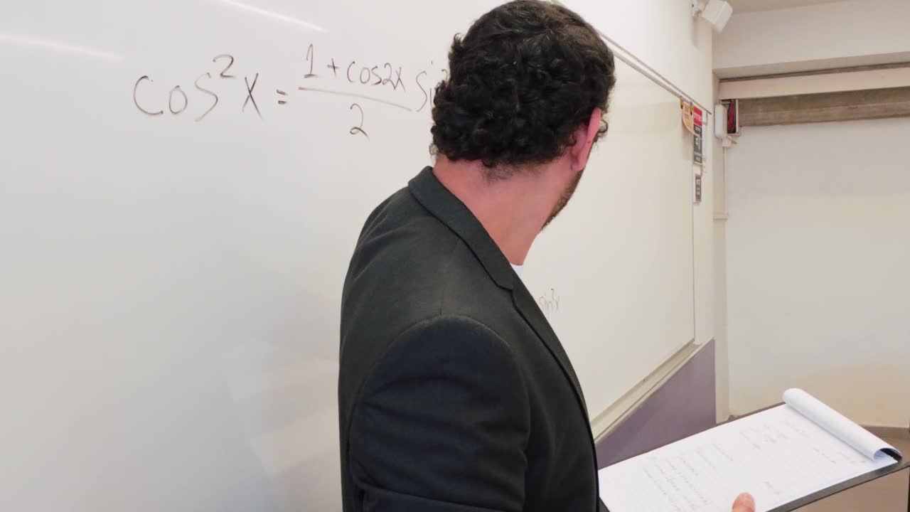 University Professor Explaining a Math Formula
