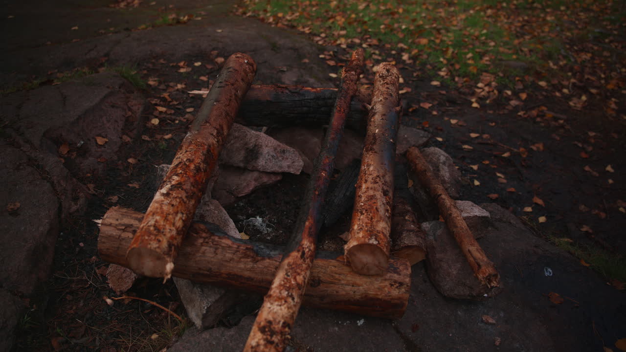 An old campfire site in the woods in the autumn season in Norway