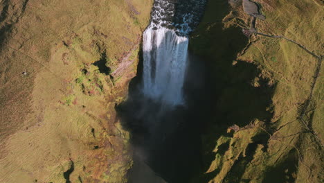 Aerial-bird's-eye-parallax-over-majestic-Skogafoss-Waterfall