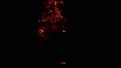 fire explosion isolated on dark black background, good for overlays with transparent alpha matte blending option