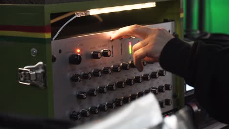 dj using a sound system controller in a party