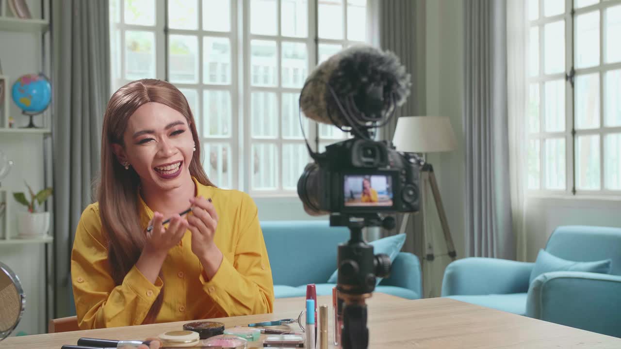 Funny Influencer Young Transgender Woman Blogger Laugh And Smile, Makeup Tutorial Video At Home Studio