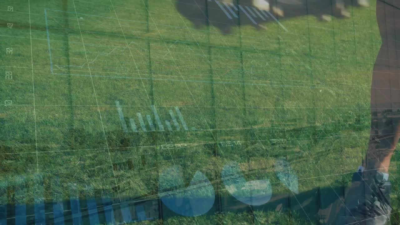 Animation of financial data and graphs over legs of caucasian male soccer player during training