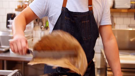 chef preparing crepe on the pan