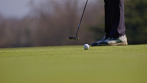 young golfer playing on a sunny spring day in switzerland, showcasing precise chipping, putting, bunker, and approach shots. perfect for sports, lifestyle, and outdoor themes.