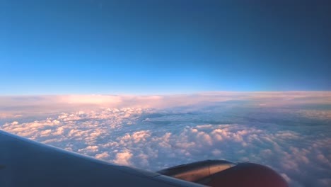 view of beautiful clouds from airplane window on a flight to ladakh india