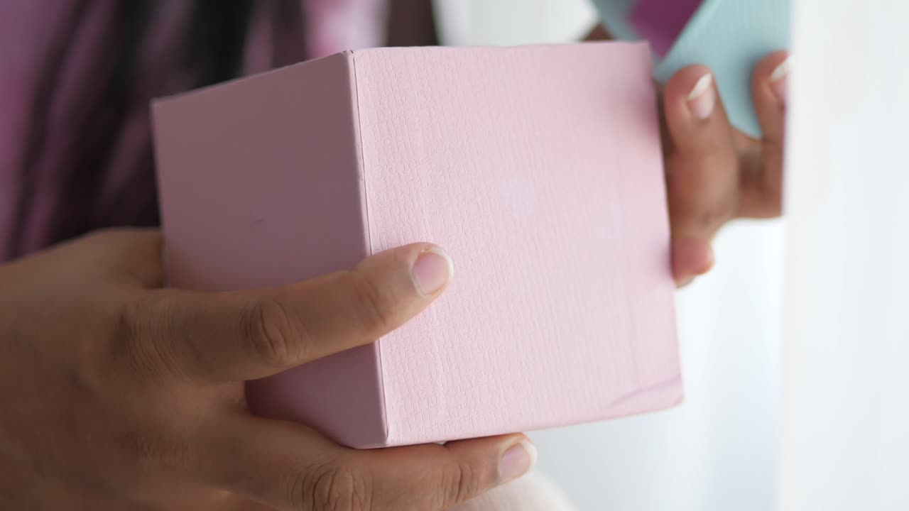 Woman Opening a Pink Gift Box