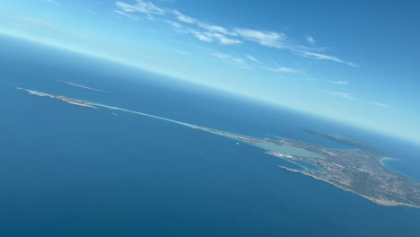 Formentera-Island,-aerial-panoramic-view-from-a-jet-cockpit-during-the-departure-from-Ibiza-Airport