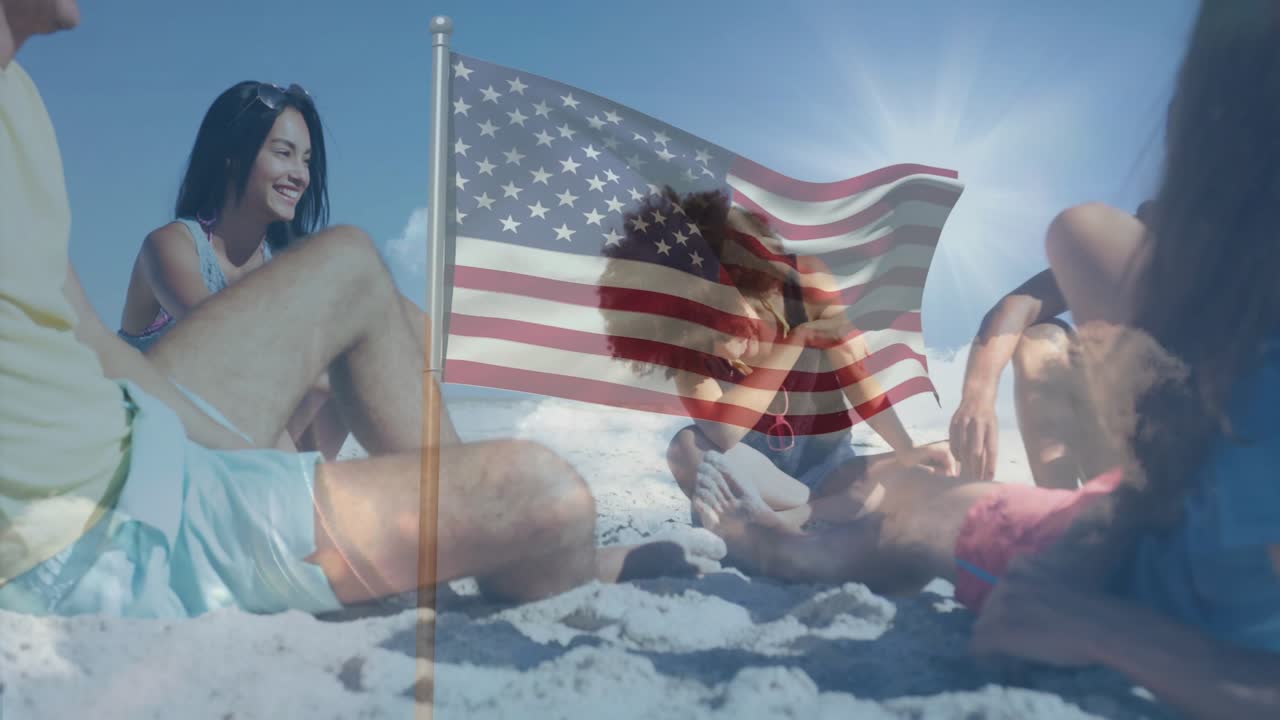Friends sitting on sunlit beach, American flag overlay moving and causing socializing for lifestyle