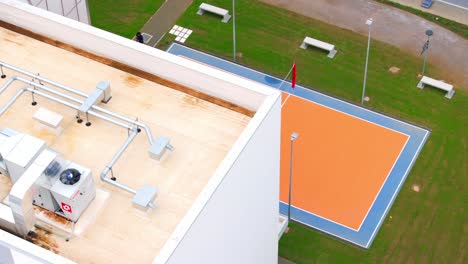 playing field, student living campus x or cx milan, novate milanese, italy. aerial drone flying directly above