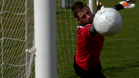 Goalkeeper-in-red-letting-in-a-goal-during-a-game