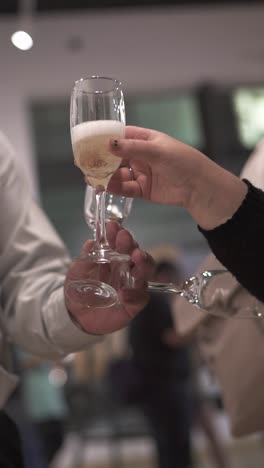 man and woman toasting together with glasses of champagne