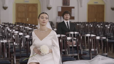 couple waiting at wedding ceremony in church