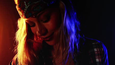 female guitarist playing electric guitar 4k