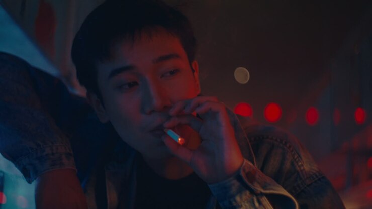 Young man smoking in a night club