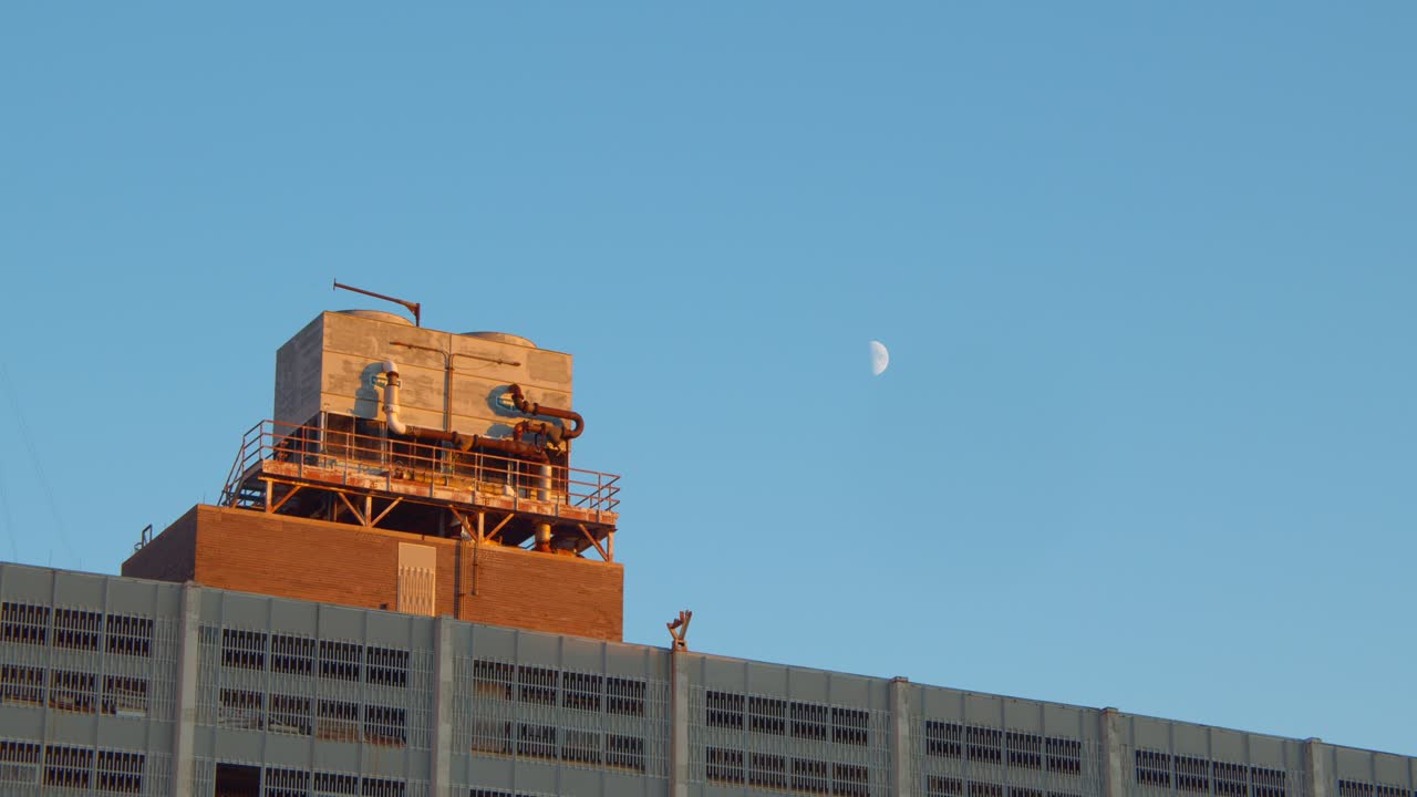 Low Angle View of Moon Over Detroit with Helicopter Flying By