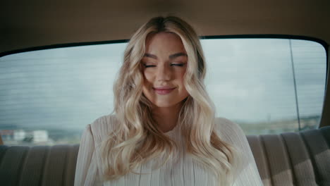 woman in a vintage car backseat