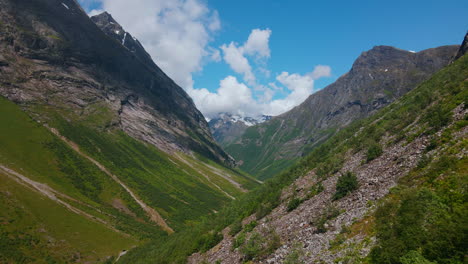 drone flying through norangsdalen, norway. close to the mountainside