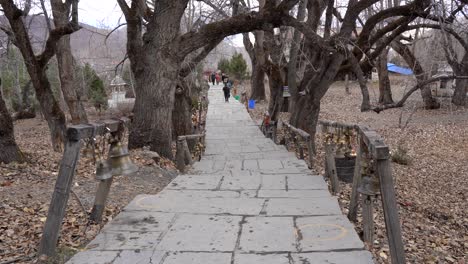 muktinath, nepal - november 20, 2021: people walking on the path up to the muktinath temple in the lower mustang region of nepal