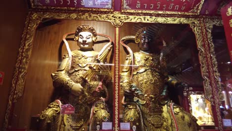 the statue of virulhaka, the guardian of south and virupaksa, the guardian of west located at wat mangkorn kammalawas , bangkok, thailand