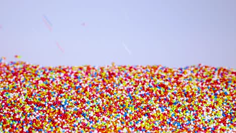 vibrant sprinkles cascade onto a surface