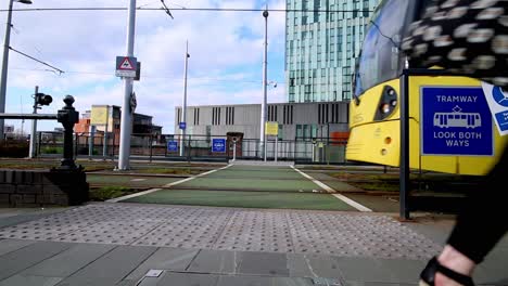 manchester , deansgate, united kingdom - 25 08 2021: manchester city centre metrolink trams at deansgate station, pedestrian city life transportation area