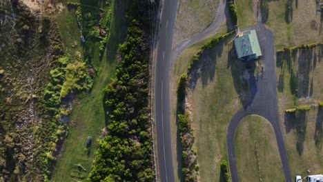 Shot-along-a-road-along-the-coast-with-farms-alongise