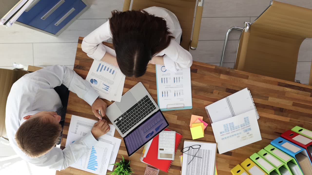 Office workspace with team and financial documents