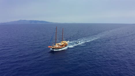 Drone-point-of-view-at-sailboat-sailing-on-Aegean-sea-in-Turkey