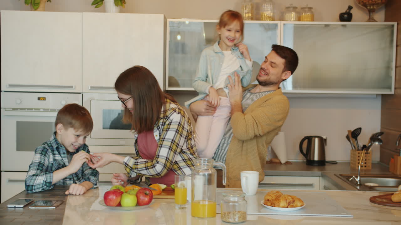 Happy Family Breakfast in the Kitchen