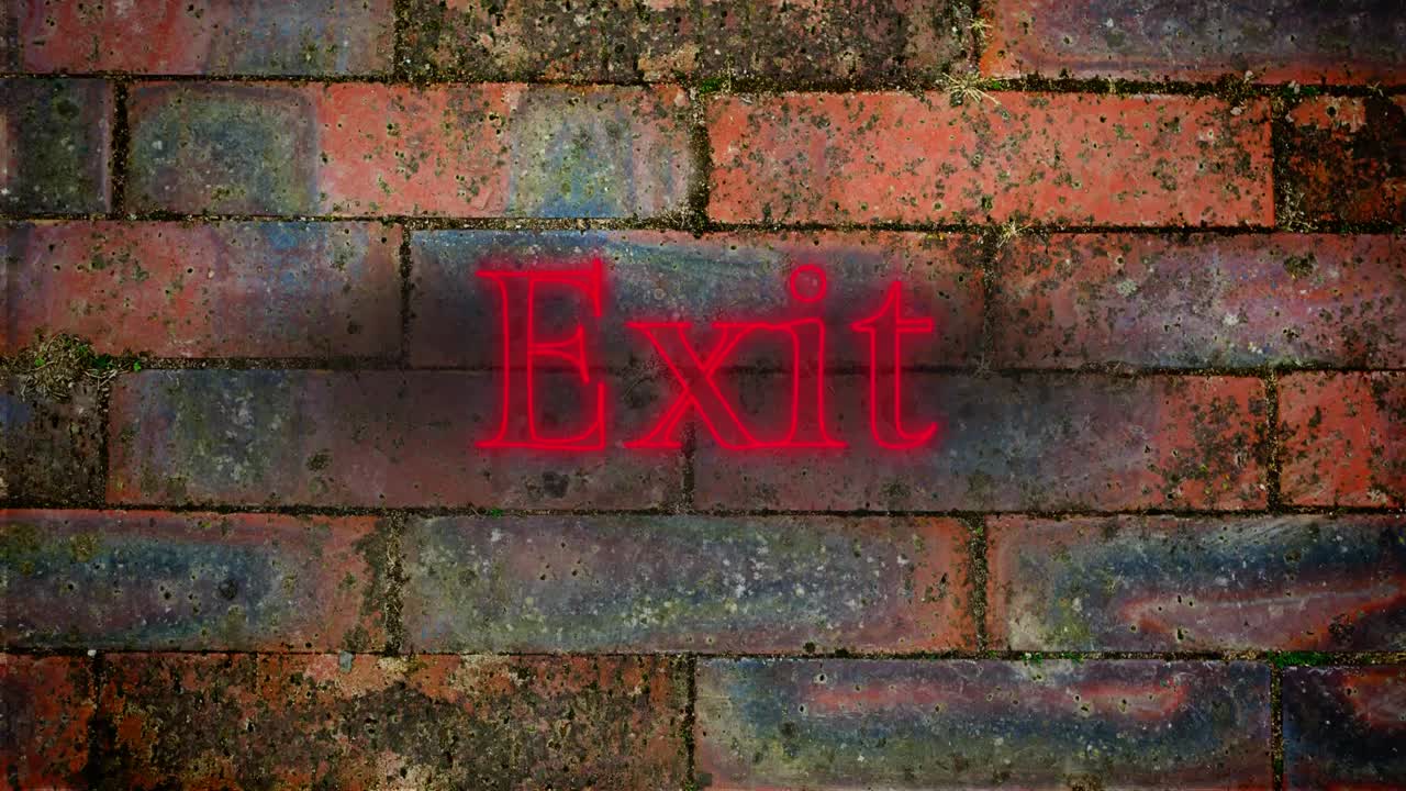 Exit red neon on brick wall