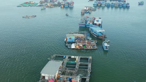 drone view of hon ro pier, on nha trang river, with many fishing boats are nailing side by side