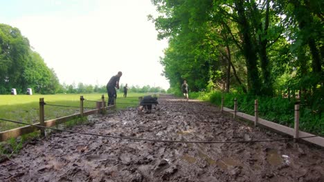 fit men training over obstacle course 4k