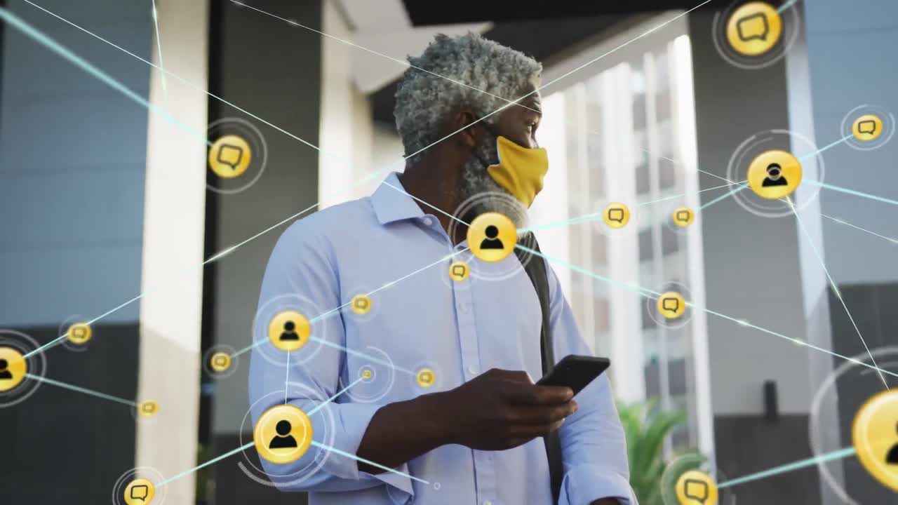 Animation of network of connections with icons over african american man using smartphone