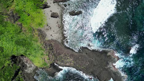 Picturesque-top-down-view-of-tropical-rocky-ocean-shore-on-a-summer-day