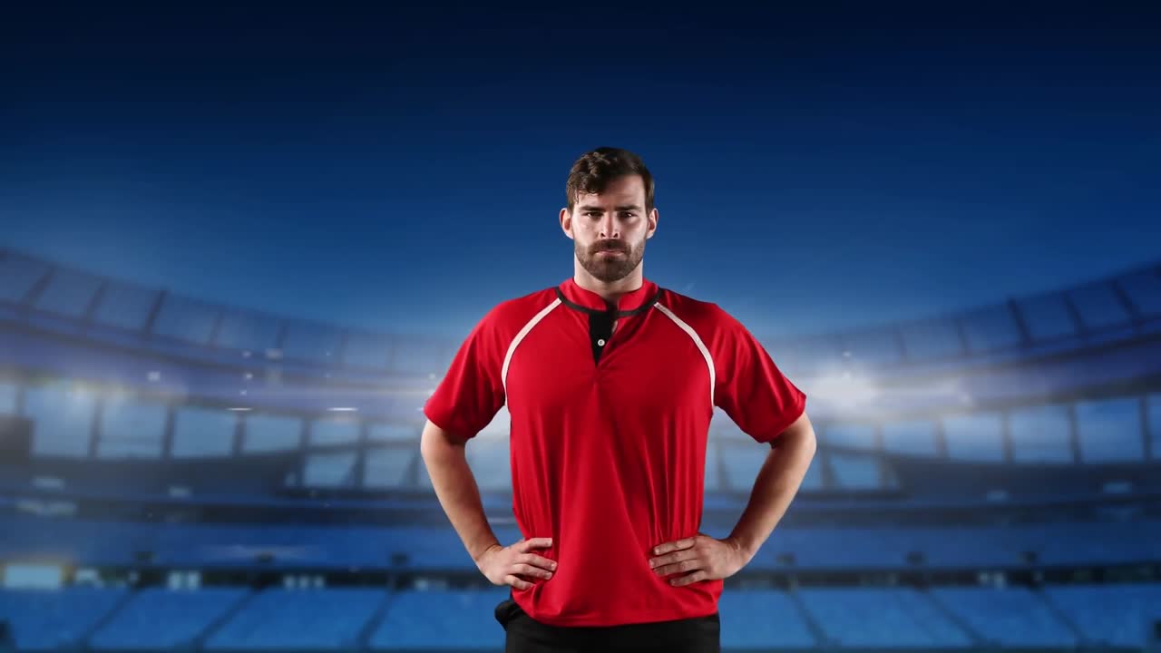 프로 럭비 선수 가 경기장 앞 에 서 있다