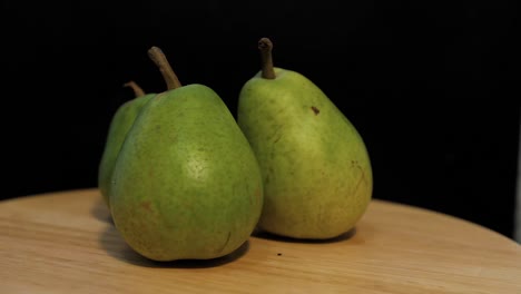 close-up of green pears. green pears rotates around its axis.