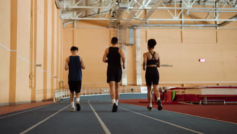 back view of athletes running