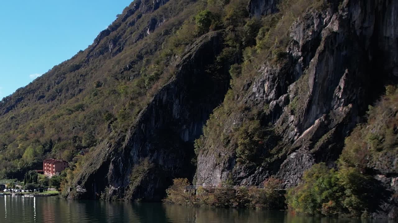 Stunning aerial view of Italian Alps reflecting in tranquil lake