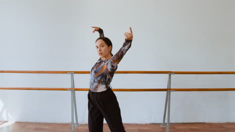 woman practicing modern dance in a studio