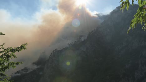 wild fire over mountain forest near lake piva in montenegro in august of 2021