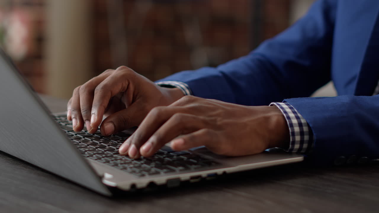 Project manager developing business presentation on laptop