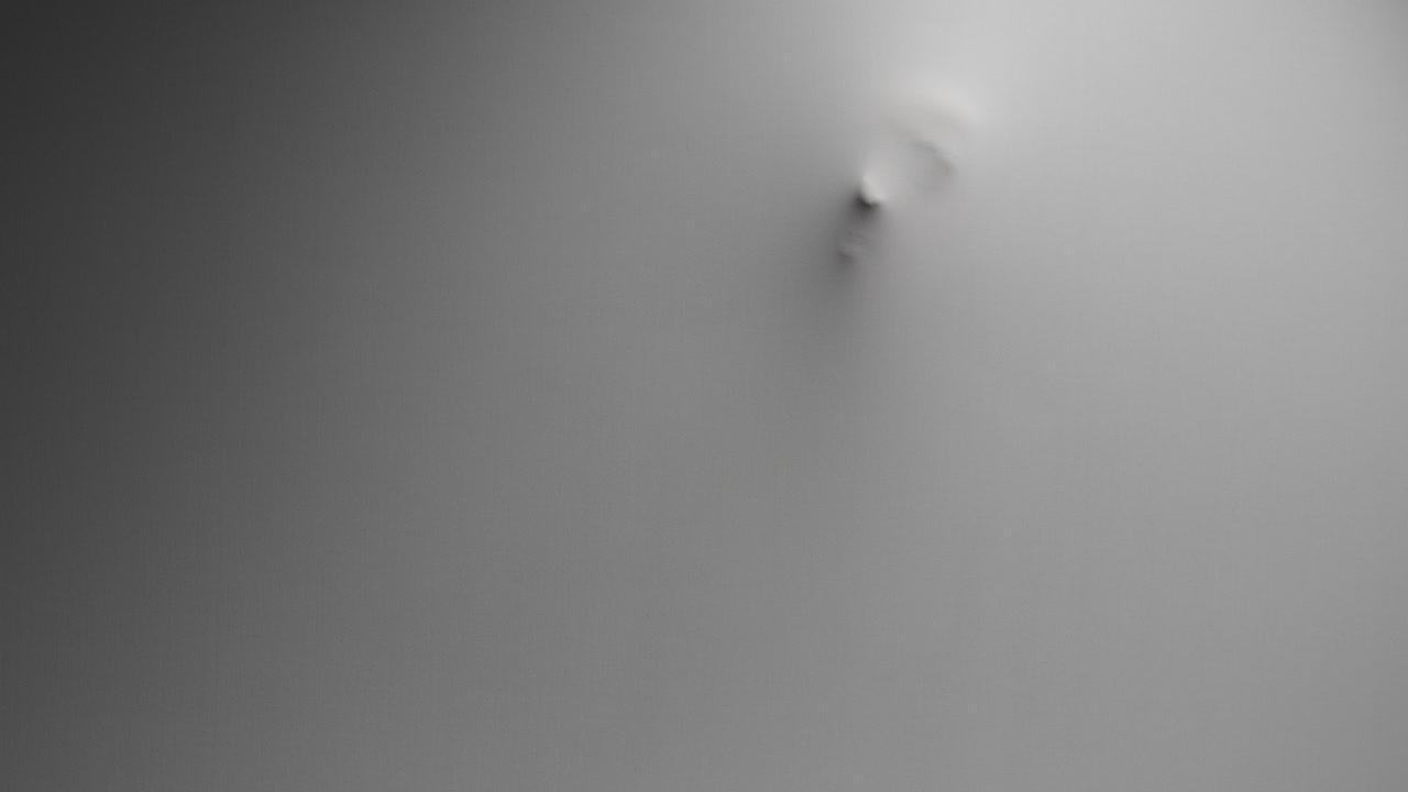 A scary silhouette of a woman appears from the white wall